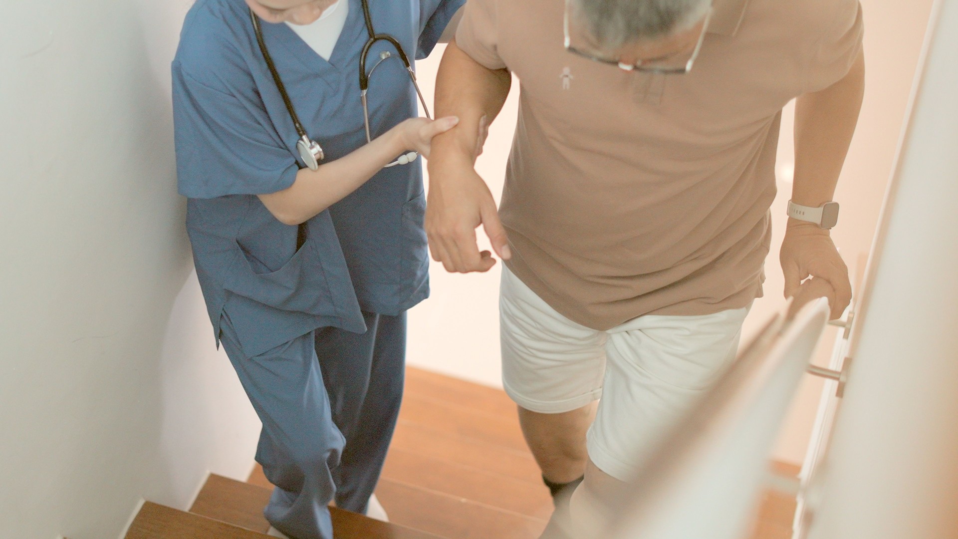 Physical therapist care into the comfort of patients’ homes. Nurses and healthcare specialists caring for elderly men with osteoarthritis or who are rehabilitating after treatment for chronic diseases. Caregiver nurse or doctor take care elderly man.